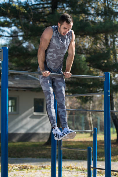 istock Sports Man Training With With Dips Bar 1219165009