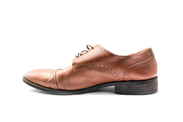 istock Men's brown leather shoes isolated on white background. 1219165890