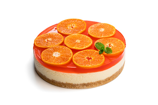 Delicious  cheese cake with jellied layer and oranges on top isolated on white