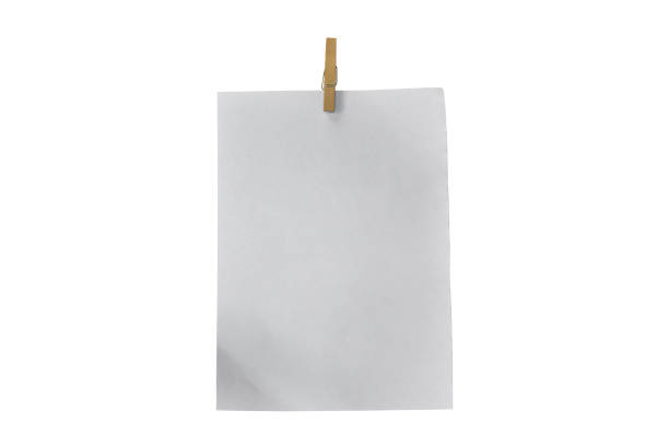 istock Wooden clip and white paper isolated on white background. Object with clipping path 1219169053