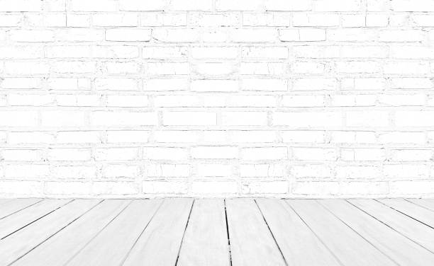 istock Vintage interior room with white wood floor and brick wall background 1219169291