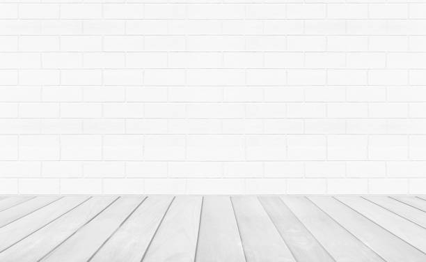 istock Vintage interior room with white wood floor and brick wall background 1219169335
