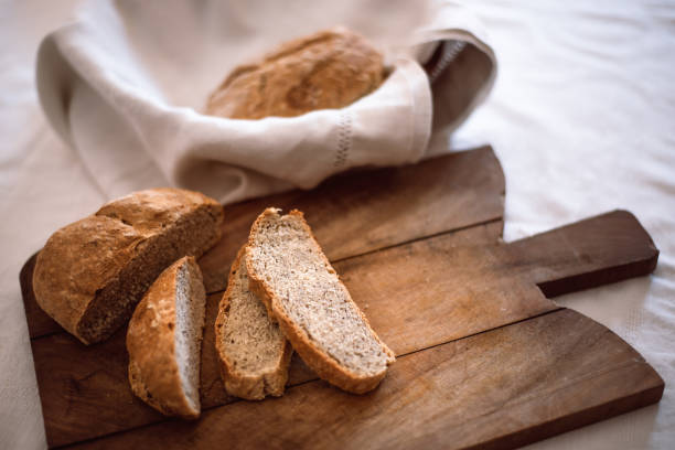 istock Homemade sliced ​​bread on a wooden cutting board 1219170777