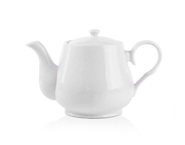 istock White teapot on white background. Side view of ceramic kettle . 1219171346