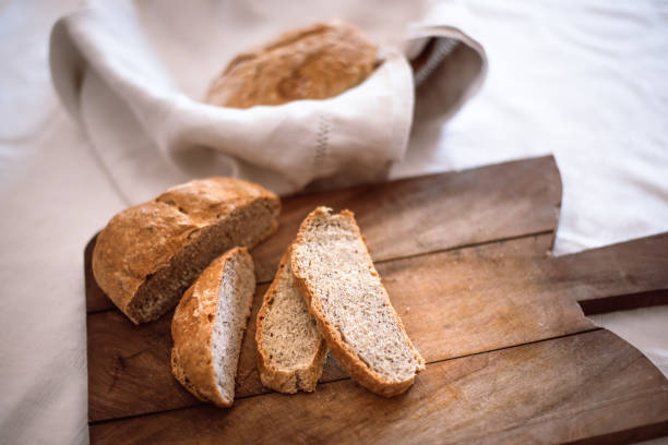istock Homemade sliced ​​bread on a wooden cutting board 1219171541