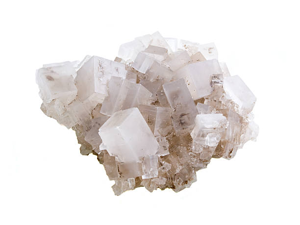 Close-up of rock salt against white background stock photo