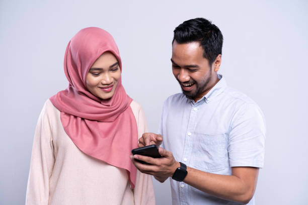 Young Asian Malay couple sharing information on mobile phone Young Asian Malay couple sharing information on mobile phone

Location: Malaysia, Kuala Lumpur iStockalypse KL malay couple stock pictures, royalty-free photos & images