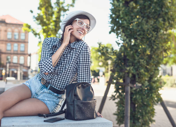 istock Beautiful young woman smiling looking something. 1219180370