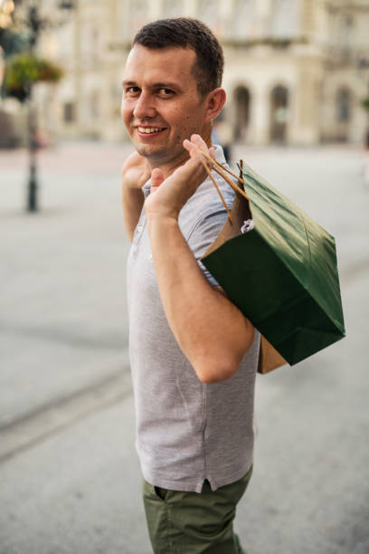 istock Man in the  walk after shopping 1219180376