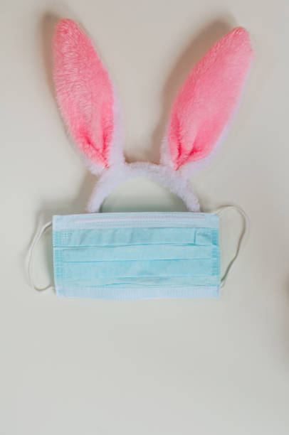 istock bunny ears are protected in a medical mask on a white background 1219180471