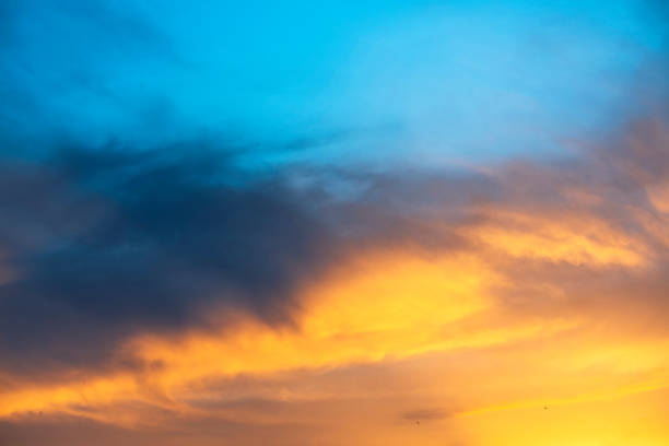 Beautiful sunset sky. Dramatic colorful clouds after sunset. Nature backgrounds.
