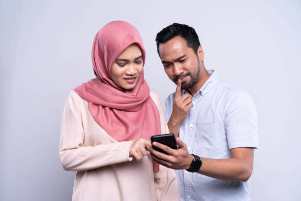 Young Asian Malay couple sharing information on mobile phone Young Asian Malay couple sharing information on mobile phone

Location: Malaysia, Kuala Lumpur iStockalypse KL malay couple stock pictures, royalty-free photos & images