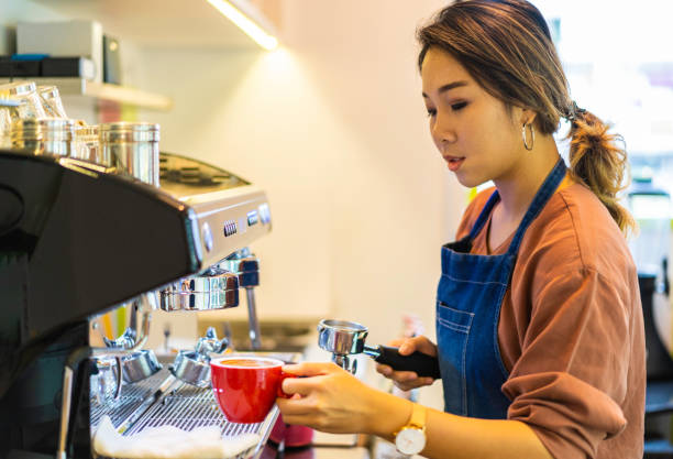 istock Asian female barista making cappuccino 1219180966