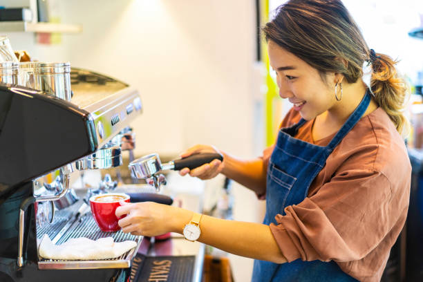 istock Asian female barista making cappuccino 1219181064