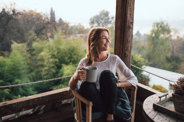 Young woman drinking coffee at home
