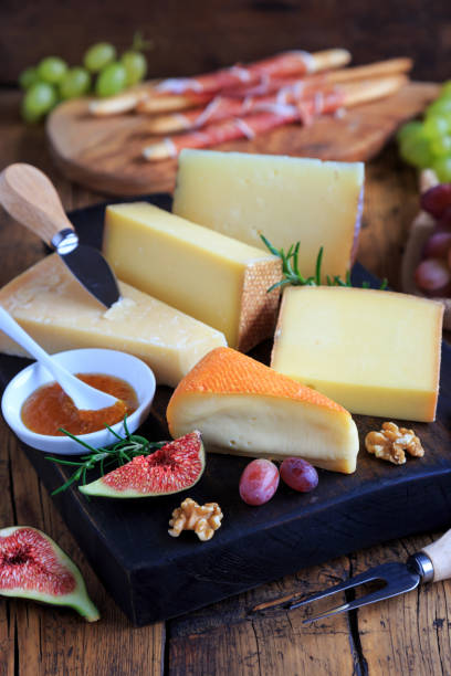 istock large selection of cheeses on wooden board 1219184393
