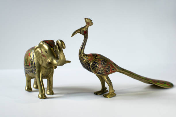 istock Small Golden Statues of Elephant and Peacock 1219184631