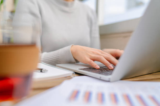 istock Close-up photo of human hand while using laptop 1219186837