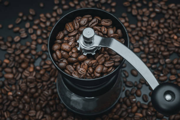 istock Roasted coffee beans in the grinder 1219187593