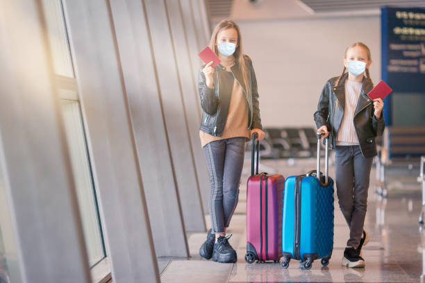 istock Little kid in airport waiting for boarding 1219188715