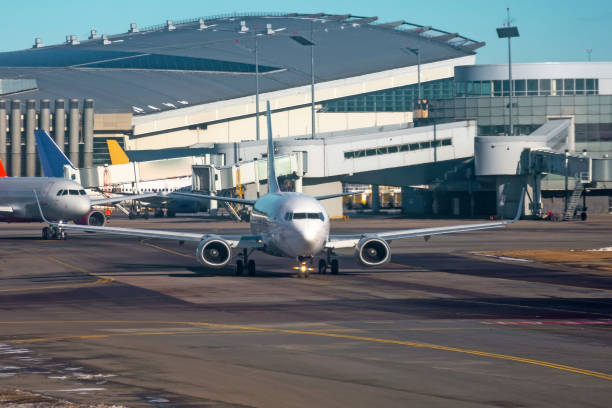 istock Airport and airplanes next to runway for take off. 1219190980
