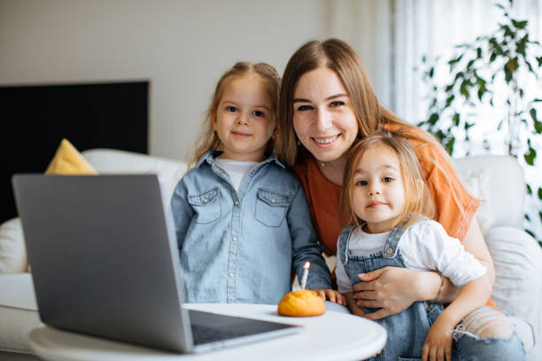 istock Beautiful mother with daughters celebrating birthday 1219190986