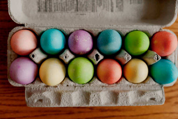 istock Cardboard Carton of Colorful Dyed Easter eggs 1219191439