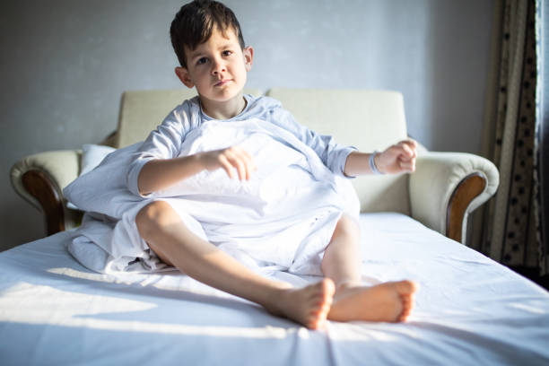 istock A cute boy waking up stock photo 1219192853
