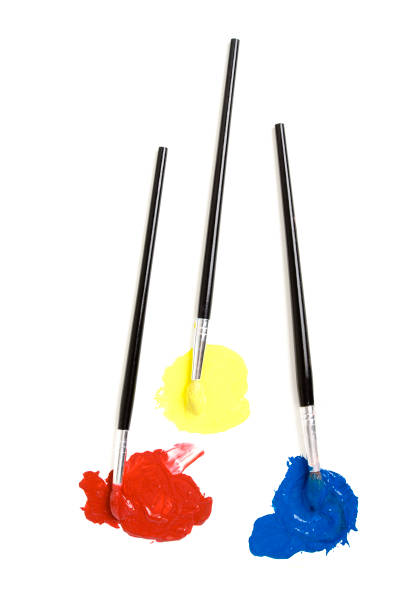 Bright blue paint being mixed with a brush for an art project.