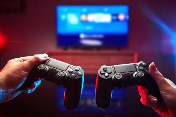 istock Gamer holding Gamepad, Controller or Videogame Joystick Console in hands. Close up, game concept 1219193936