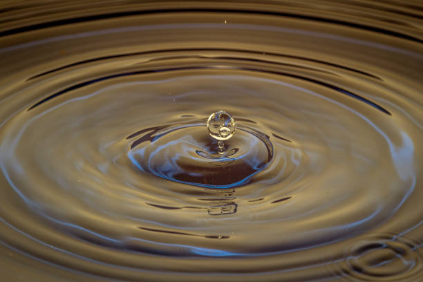 istock Splash of water crown on colored surface 1219196201
