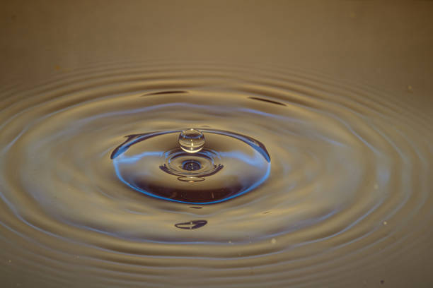 istock Splash of water crown on colored surface 1219196243