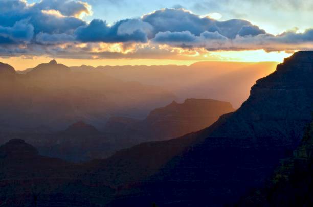 istock Rising sun lights up the canyon and dramatic sky 1219197040