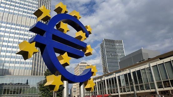 August, 2019, Euro sign at European Central Bank headquarters in the evening, business district in Frankfurt am Main, Germany.