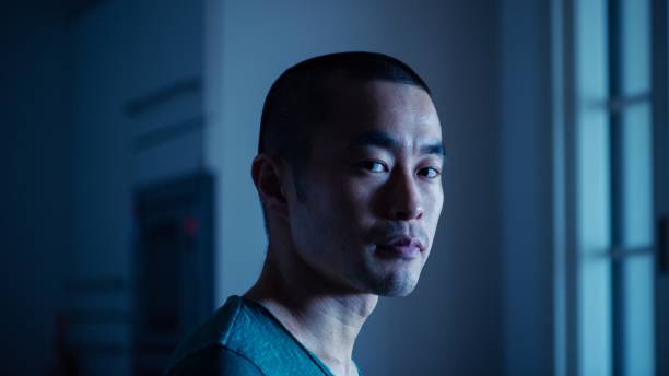 istock Portrait of millennial man with shaved head 1219199243