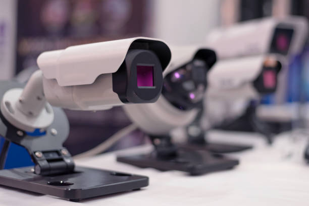 istock Security CCTV camera or surveillance system in office building, Intelligent cameras can record video all day and night to keep you safe from thieves. Surveillance camera Anti-theft system concept. 1219200455