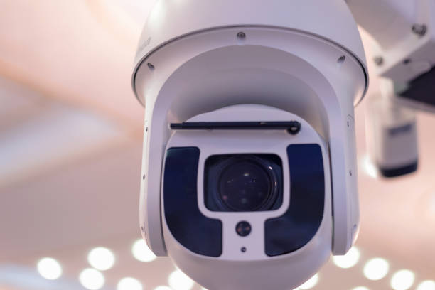 istock Security CCTV camera or surveillance system in office building, Intelligent cameras can record video all day and night to keep you safe from thieves. Surveillance camera Anti-theft system concept. 1219201628