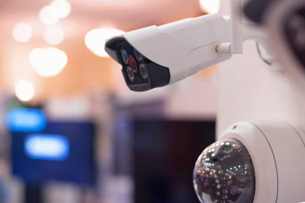 istock Security CCTV camera or surveillance system in office building, Intelligent cameras can record video all day and night to keep you safe from thieves. Surveillance camera Anti-theft system concept. 1219201922