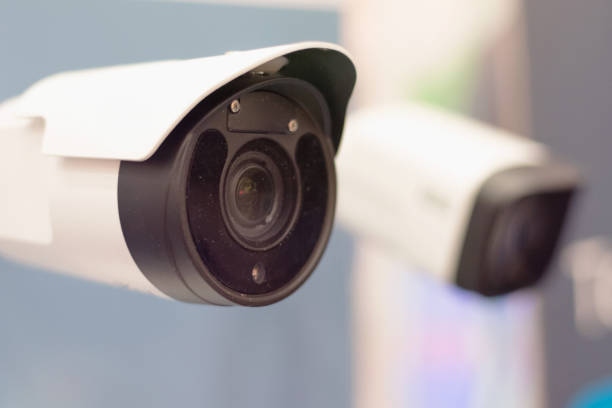 istock Security CCTV camera or surveillance system in office building, Intelligent cameras can record video all day and night to keep you safe from thieves. Surveillance camera Anti-theft system concept. 1219202138