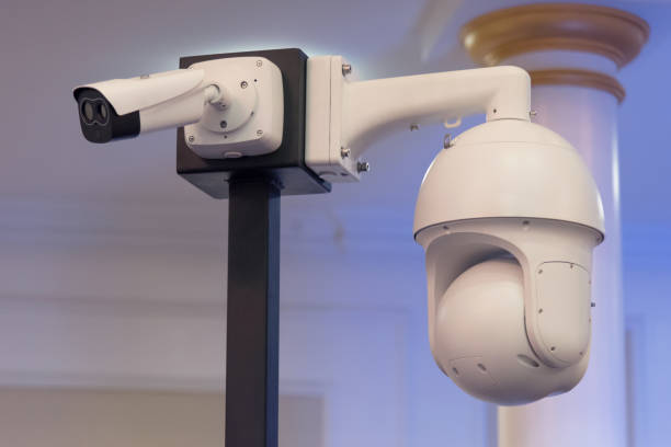 istock Security CCTV camera or surveillance system in office building, Intelligent cameras can record video all day and night to keep you safe from thieves. Surveillance camera Anti-theft system concept. 1219203647