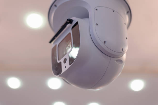 istock Security CCTV camera or surveillance system in office building, Intelligent cameras can record video all day and night to keep you safe from thieves. Surveillance camera Anti-theft system concept. 1219203689