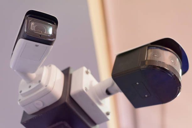 istock Security CCTV camera or surveillance system in office building, Intelligent cameras can record video all day and night to keep you safe from thieves. Surveillance camera Anti-theft system concept. 1219203888
