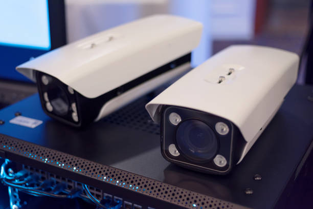 istock Security CCTV camera or surveillance system in office building, Intelligent cameras can record video all day and night to keep you safe from thieves. Surveillance camera Anti-theft system concept. 1219203983