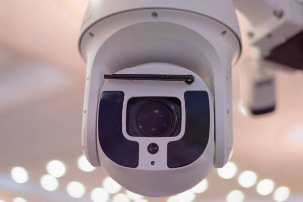 istock Security CCTV camera or surveillance system in office building, Intelligent cameras can record video all day and night to keep you safe from thieves. Surveillance camera Anti-theft system concept. 1219204056
