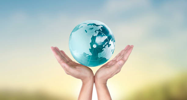 istock Globe , earth in human hand, holding our planet glowing.  image provided by Nasa 1219205165