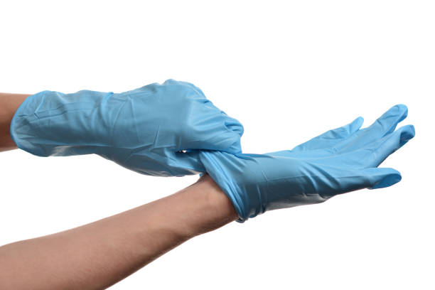 istock Hand with blue protective glove isolated on white background 1219206858