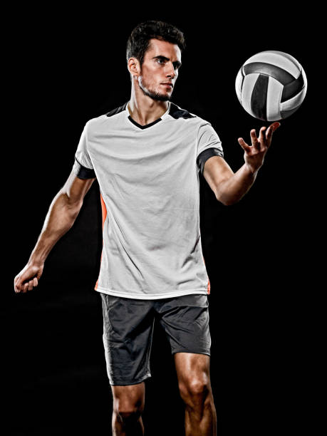 caucasian young volley ball player manisolated black background one caucasian young volley ball player man in studio isolated on black background volleyball ball volleying isolated stock pictures, royalty-free photos & images