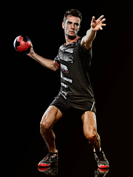 istock caucasian young handball player man isolated black background 1219207768
