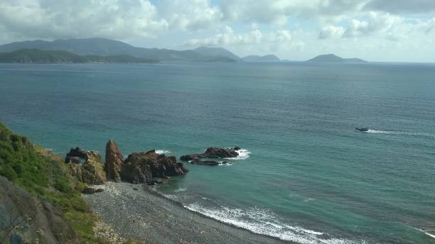 istock seascape, rocky beach, black cliffs and blue sea 1219209893