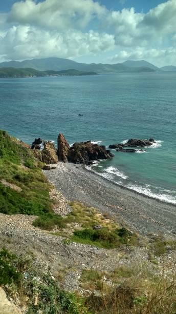 istock seascape, rocky beach, black cliffs and blue sea 1219209897